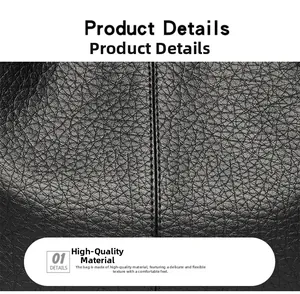Close-up of premium black pebble grain leather with fine vertical stitching on handbag