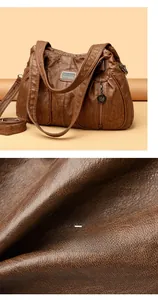 Close-up of retro dark brown leather bag showing textured grain and vintage metal buckle