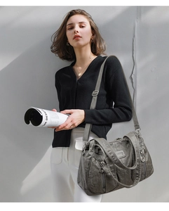 Grey faux leather tote bag with vintage pleated texture and adjustable shoulder strap