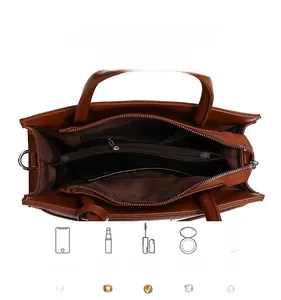 Top view of brown leather handbag interior showing multiple compartments and storage capacity