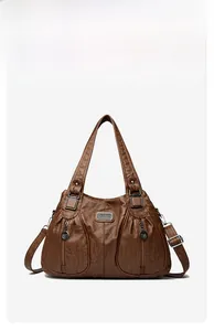 Detail view of brown vintage PU leather handbag with pleats and metal zipper pockets