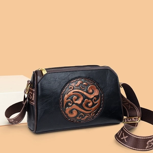 Vintage black leather crossbody bag with brown cloud pattern embossment and wide strap
