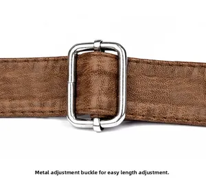 Macro shot of brown lychee grain leather strap with polished silver adjustable metal buckle
