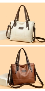 Detail view of vintage tote bags in cream and brown leather with elegant shoulder straps