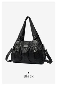 Detail of black vintage shoulder bag with silver hardware and brand name OUYALU