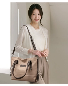 Detailed shot of large contrast tote bag with lychee grain leather and shoulder strap