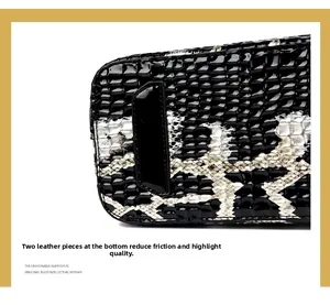 Detail view of the black crocodile pattern handbag base with protective leather patches