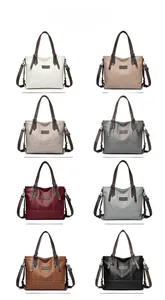 Detailed view of large leather tote bags available in eight diverse fashion colors
