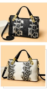 Detail of crocodile pattern texture on tote bag with vintage gold metal hardware