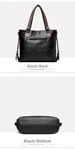 Detail view of black tote bag showing back zipper pocket and smooth flat bottom surface