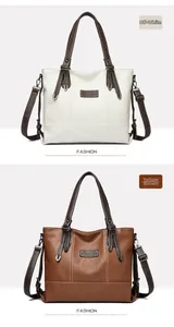 Detail of faux leather tote bag with brand label and buckle in cream and brown
