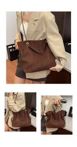 Detail of a brown suede bucket bag featuring a black chain strap and drawstring accents