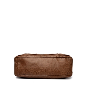 Deep brown vintage leather shoulder bag showing reinforced bottom stitching and texture