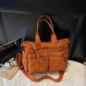 Caramel quilted tote bag with large capacity, shoulder strap and stylish exterior pockets