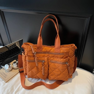 Caramel quilted large tote bag with zipper pockets for urban commuting and office style