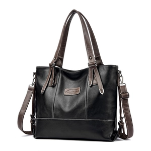 Sac fourre-tout noir en cuir avec poignées marron et coutures contrastées blanches