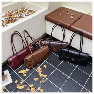 Detailed display of four vintage shoulder bags in burgundy, brown, coffee, and black tones