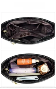 Layout interno della borsa a tracolla in pelle nera con tasche multiple e fodera