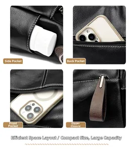 Detail der schwarzen Leder-Tote-Tasche mit mehreren Taschen und Funktionsreißverschluss