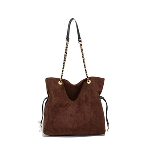 Brown frosted suede bucket bag with black leather and gold metal chain strap on white background
