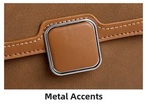 Macro view of caramel brown lychee leather handbag featuring square silver metal buckle detail