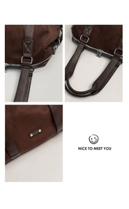 Detail of coffee brown tote with dual silver zippers and cross-stitched handles