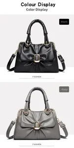 Detail of elegant bow design and gold buckle on stylish black and grey tote bags