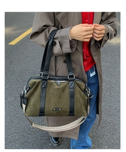 Detail of army green suede tote bag with vintage geometric woven shoulder strap
