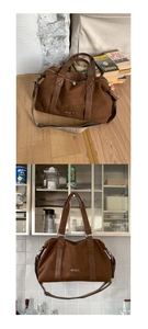 Close-up of brown suede tote bag featuring a decorative colorful woven wide shoulder strap