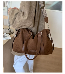 Brown suede hobo bag with vintage texture and patterned wide shoulder strap for women