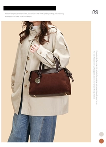 Close-up of brown suede Boston bag featuring gold F-pendant and smooth leather trim