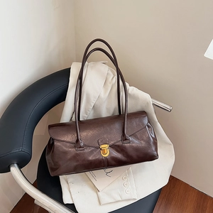 Retro dark brown leather baguette bag with gold metal buckle and long shoulder straps
