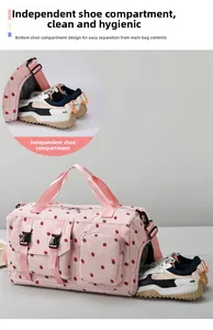 Pink travel bag detail featuring a dedicated independent bottom compartment for shoes