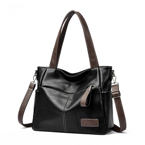 Große Shopper-Tasche aus Leder in Schwarz und Braun mit Kontrastnähten und Gurt