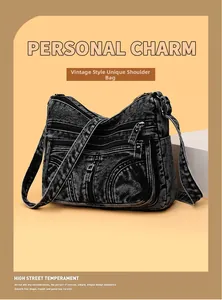 Dettaglio borsa a tracolla in denim lavato vintage con tasche multiple con zip e cinturino