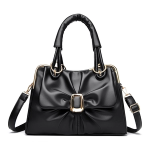 2025 stylish bow handbag with golden buckle and sleek black PU leather for women