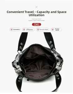 Vista dall'alto della borsa tote in pelle nera con fodera interna e rivetti metallici