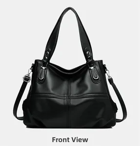 Vista dettagliata della borsa tote in pelle nera con finiture argentate e cuciture