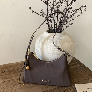Minimalist retro half-moon underarm bag in matte dark brown with adjustable shoulder strap