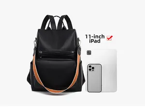 Detail view of black faux leather backpack fits 11-inch iPad with striped strap