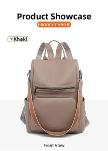Detail of khaki PU leather backpack showing lychee texture and colorful woven strap