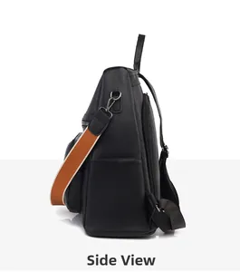 Side view of black pebble leather backpack with a colorful woven shoulder strap