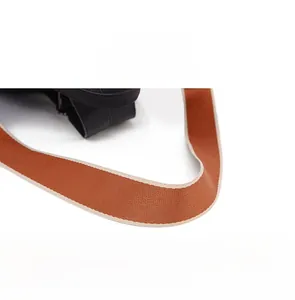 Detail of high-density woven wide shoulder strap in orange brown for PU travel backpack