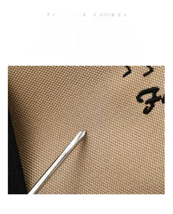Close-up of scratch-resistant high-density Oxford fabric and fine embroidery on travel bag