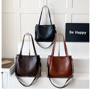 Detailed display of large capacity tote bags in black, dark coffee and light brown colors