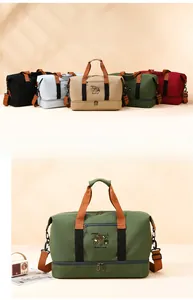 Detail view of large travel bag with separate shoe compartment and embroidery