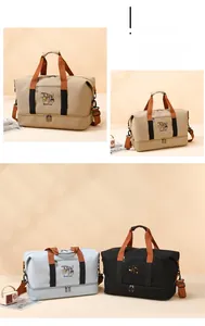 Detail of travel bag showing reinforced handles, shoe compartment, and vintage canvas texture