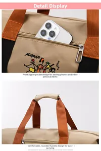 Detail of travel bag showing front zipper pocket and reinforced rounded khaki handles