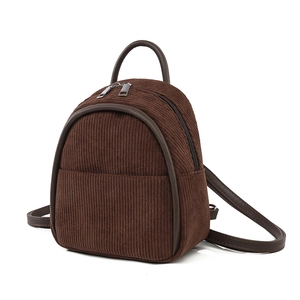 Brown corduroy mini backpack with faux leather trim and silver zipper for travel