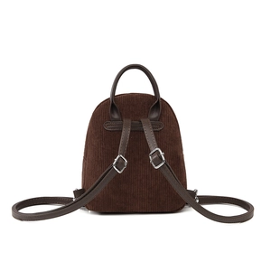 Back view of brown corduroy mini backpack with adjustable dark leather straps